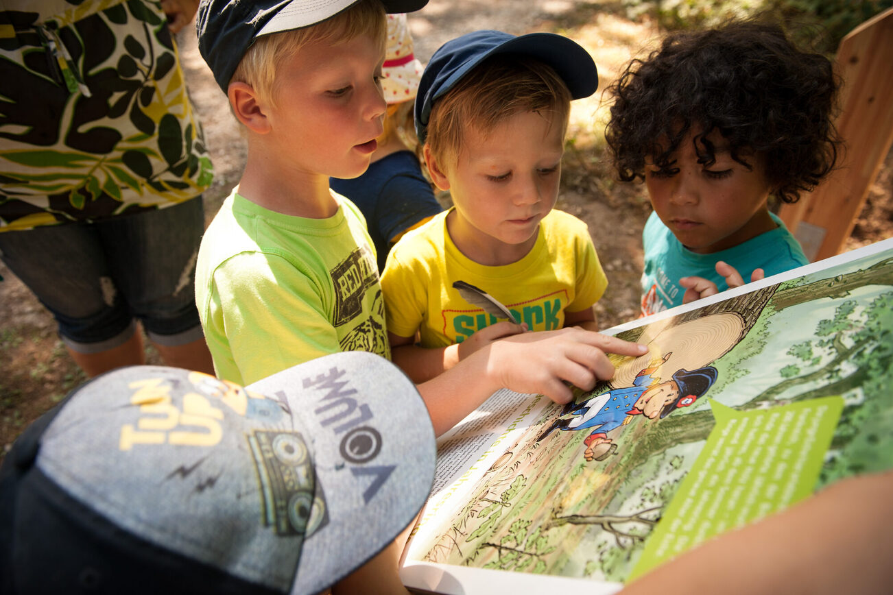 Children look at a map