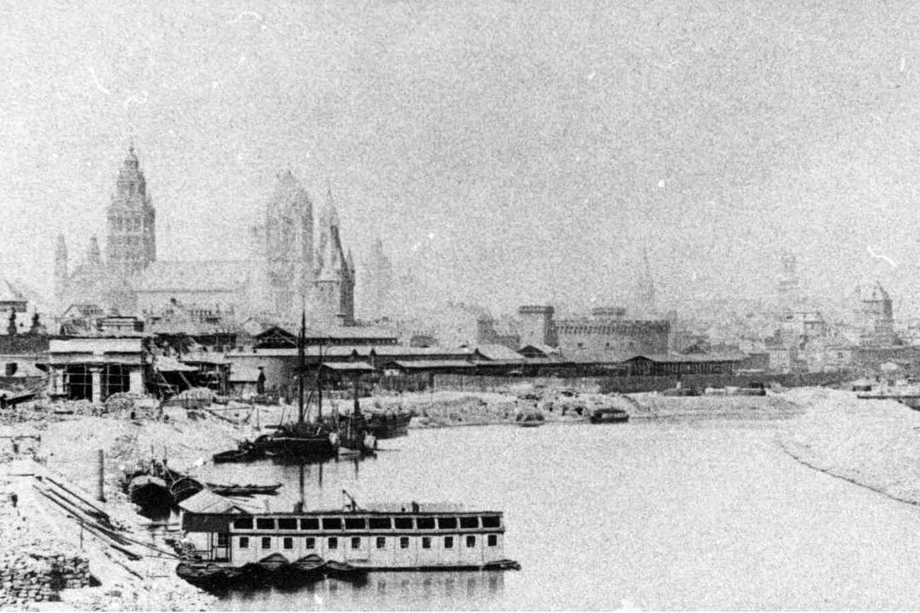 Historical view of Mainz from the end of the winter harbor to the cathedral and Rhine with railroad, port facilities and cargo ships