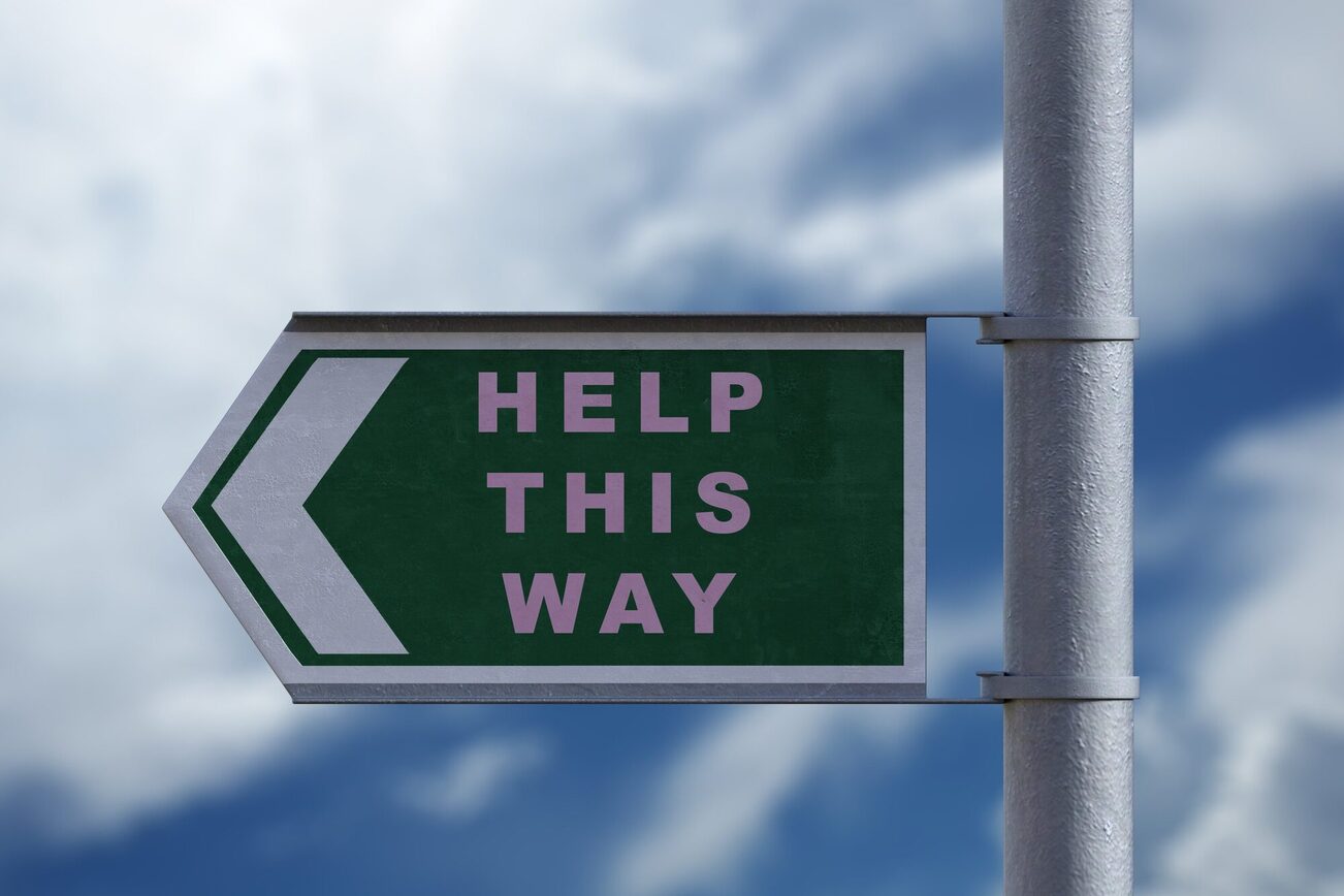 Табличка з написом "Допомогти таким чином