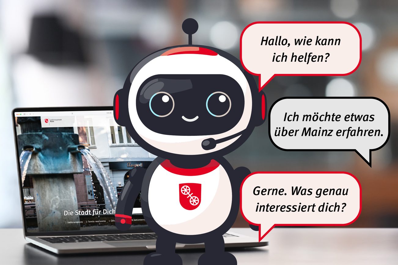 Un personnage robotique se trouve au premier plan avec des bulles, derrière lui se trouve un ordinateur portable qui affiche la page d'accueil de mainz.de